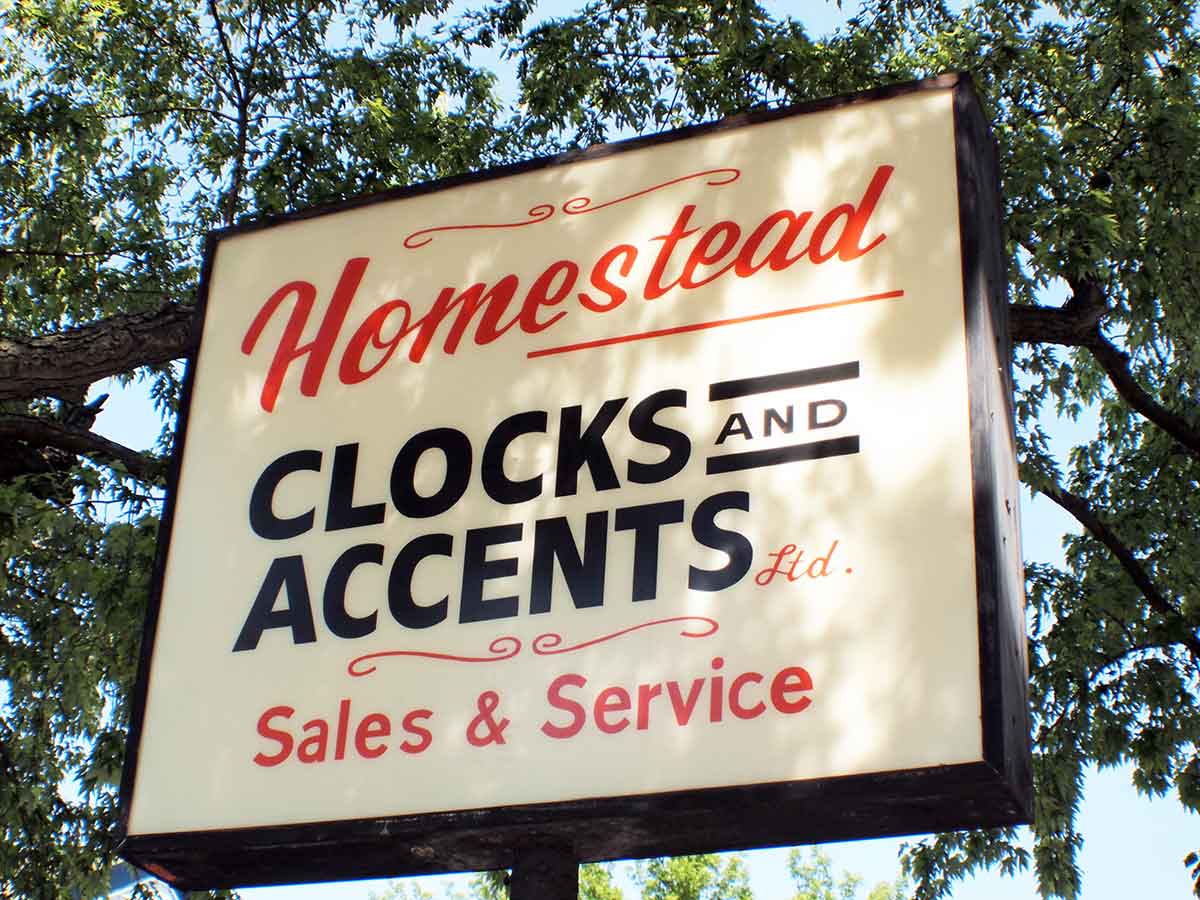 Homestead Clocks and Accents sign